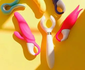 Sex toys on yellow background